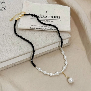 Asymmetric black crystal beads and white pearl necklace with gold lobster clasp
