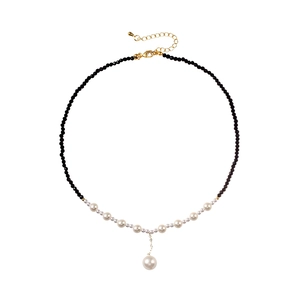 French luxury necklace with black crystal beads and gradient white pearls on white background