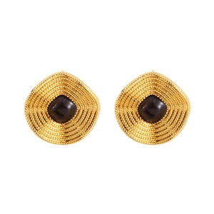 Irregular gold earrings with black onyx-style stone and vintage textured concentric pattern
