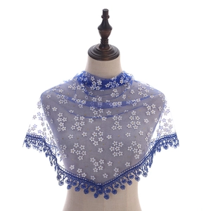 Detailed blue lace embroidery shawl with white floral patterns and elegant fringe tassels