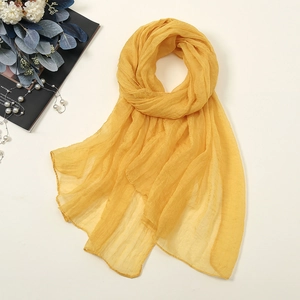 Detailed texture of bright yellow 30D chiffon scarf with stylish pleated finish
