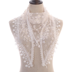 Triangle lace scarf with yellow floral embroidery and tassel details on white mesh