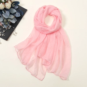 Detail view of light pink 30D chiffon scarf with delicate texture and stitched edges