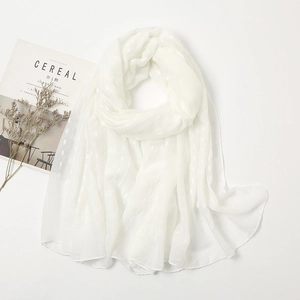White lightweight linen scarf with textured polka dot pattern on a minimalist background