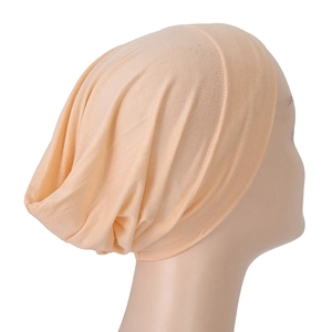 Beige modal jersey underscarf hijab cap with soft pleats on a model display