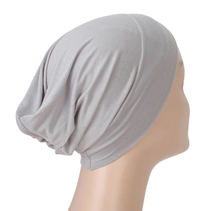 Macro detail of breathable light grey modal hijab undercap on a display head model
