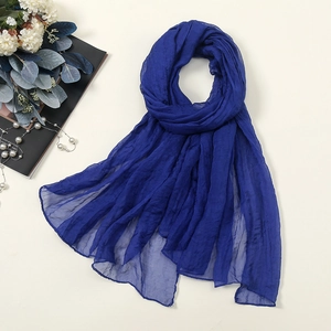 Detail of royal blue 30D chiffon scarf showing lightweight crinkled texture and sheer fabric
