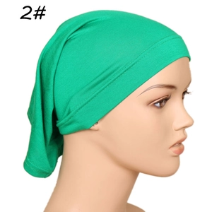 Detailed side view of green modal inner hijab cap on mannequin with elastic edge