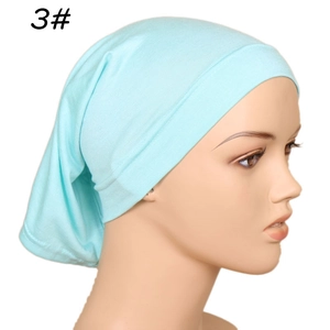 Close-up of light blue modal cotton underscarf cap with elastic ribbed edge on mannequin