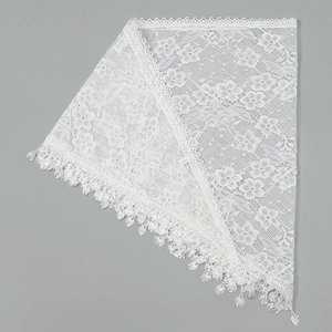 Detailed close-up of white floral lace triangle scarf with elegant fringed edges