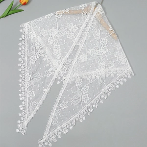 Elegant white lace shawl with floral crochet patterns and delicate fringe trim detailing