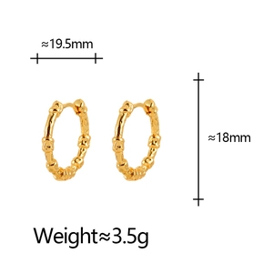 Detail showing irregular bamboo texture and dimensions of gold hoop earrings