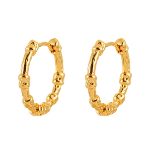 Elegant gold hoop earrings with irregular textured lava design and minimalist aesthetic