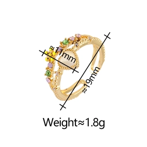 Detail view of double-layer gold open ring with heart cat-eye stone and small gemstones