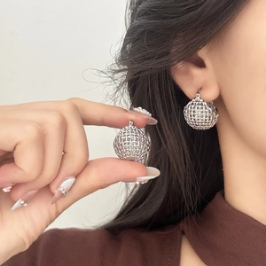 Silver hollow woven ball earrings with a minimalist grid design for a modern look