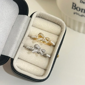 Elegant gold and silver bow rings with pearls and zircon set in a premium jewelry box