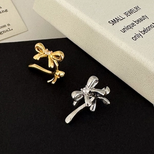Minimalist bow-knot ear cuffs with center crystal in gold and silver plating