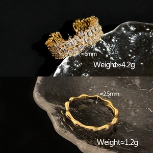 Detail showing two gold cubic zirconia rings with specific width and weight measurements
