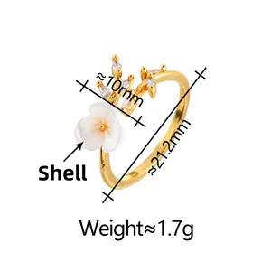 Detailed view of gold shell flower ring with cubic zirconia leaves and sizing info