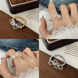 Elegant beaded ring featuring large faceted clear crystals in gold and silver finish