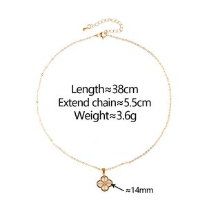 Detail view of gold clover necklace with size labels and precise measurements