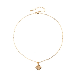 Elegant gold necklace with clover pendant featuring radial crystals and adjustable clasp