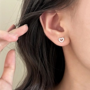 Elegant hollow heart stud earrings in silver with shimmering micro-pave zircon crystals