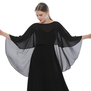 Detailed view of lightweight black chiffon shawl layered over an elegant evening dress