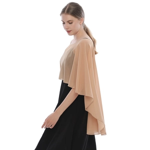 Elegant apricot chiffon shawl over black dress, flowing lightweight fabric side view