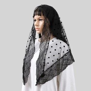 Detailed close-up of black mesh mantilla veil with floral lace trim and flocking dots
