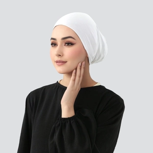 Close-up detail of white mercerized cotton hijab cap with soft breathable knitted texture