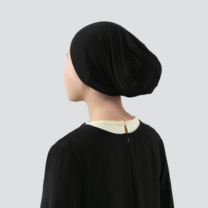 Rear view of black mercerized cotton hijab cap showing soft folds and fit on a model