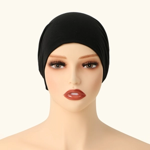 Detail of black double-layered stretch cotton hijab cap on a mannequin head
