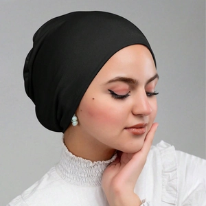 Elastic mercerized cotton black turban headwrap for women shown on a model
