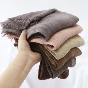Lightweight textured hijab shawl with raw fringe edges in various neutral muted colors