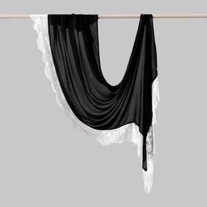 Detail of elegant black chiffon scarf featuring delicate white floral eyelash lace borders