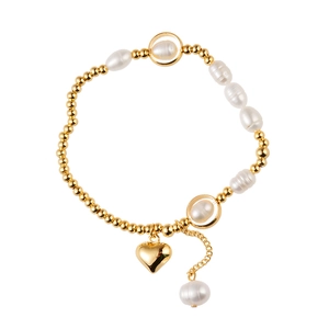 Elegant freshwater pearl bracelet with golden beads and a polished heart pendant
