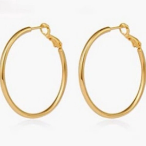 Polished gold large hoop earrings with classic round geometric design for women