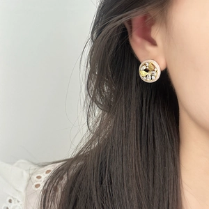 Elegant French vintage gold butterfly stud earrings with zircon stones on model