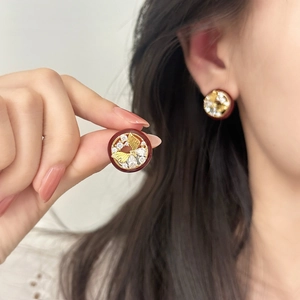 Vintage round enamel butterfly earrings with zircon inlay shown on model and in hand