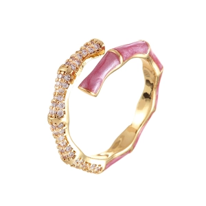 Bamboo style open ring with pink enamel and white cubic zirconia in gold finish