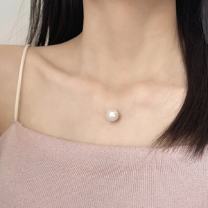 Elegant minimalist floating pearl necklace on transparent fishing line for women