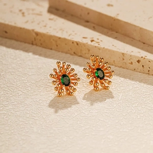 Luxurious gold sunburst earrings with emerald green oval zircon center stone