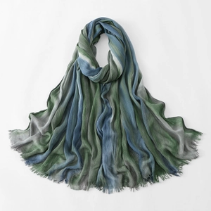 Detail of pleated texture and rainbow gradient stripes on lightweight women shawl