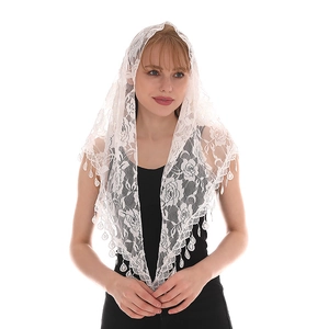 Detail of white lace triangle scarf with rose floral embroidery and fringe tassels
