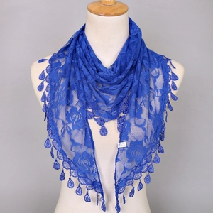 Detailed view of royal blue lace shawl with rose floral patterns and teardrop tassels