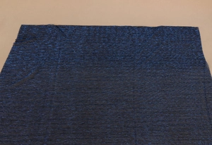 Detail of dark blue scarf fabric with fine pleated texture and metallic golden thread