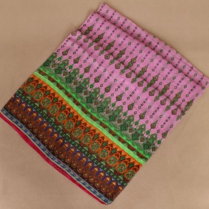 Flat lay of pink chiffon scarf with ethnic patterns and colorful geometric borders