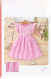 Close-up of pink girls' dress with butterfly print mesh skirt and ribbed top detail