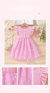 Close-up of pink tulle mesh dress featuring intricate butterfly embroidery and neat stitching